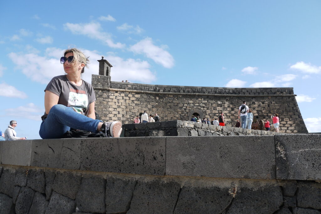 Mel posing in front of Castillo de San Gabriel January 2026
